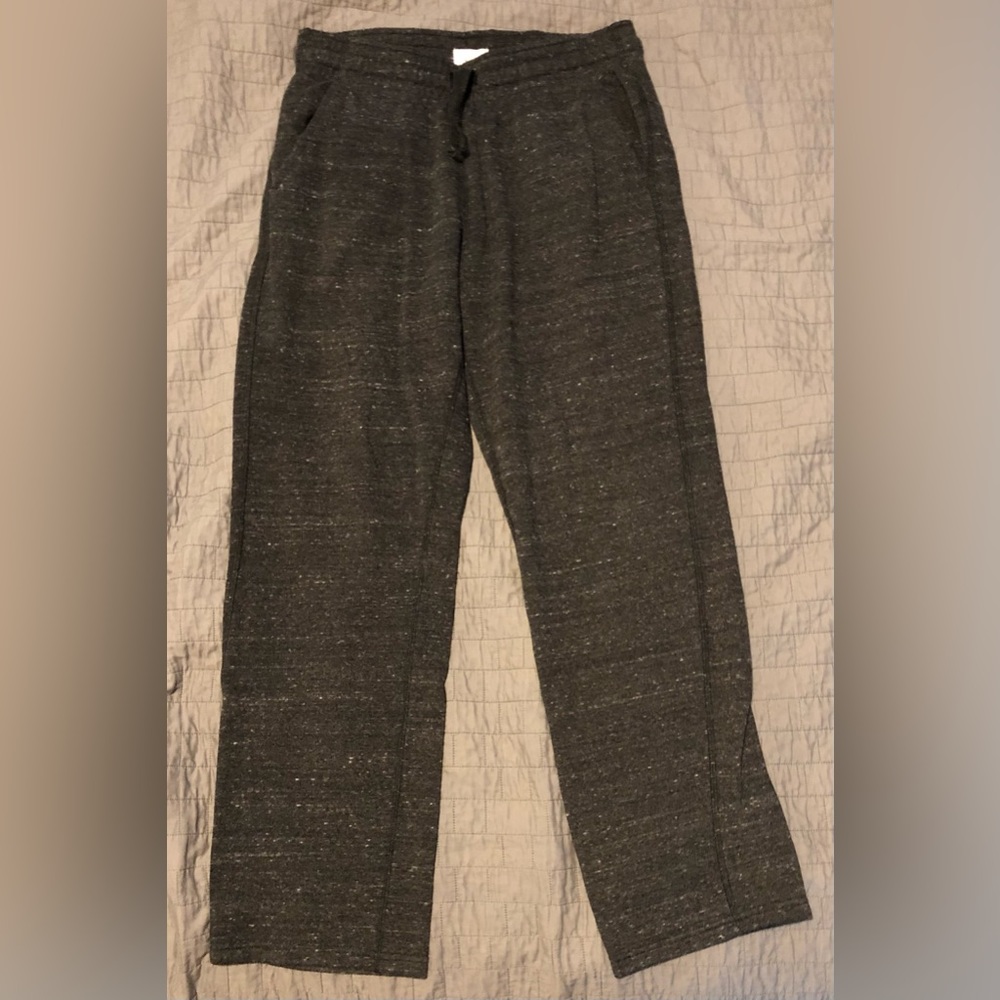 Black sweat pants, spotted white. Size small.